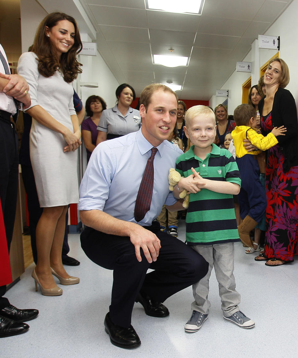 LONDON, UNITED KINGDOM - SEPTEMBER 29: Prince William, Duke of Cambridge meets patient Ellis Andrews, during a visit with Catherine, Duchess of Cambridge to open the new Oak Centre for Children and Young People at The Royal Marsden Hospital on September 29, 2011 in London, England. (Photo by Kirsty Wigglesworth - WPA Pool /Getty Images)