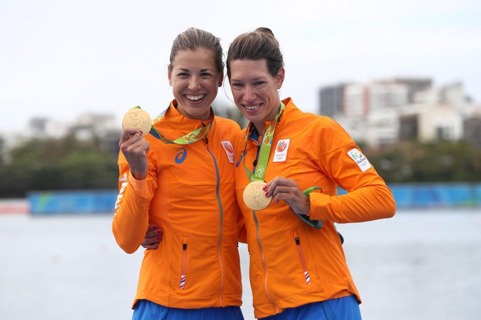 <p>Gold medalists Ilse Paulis and Maaike Head of the Netherlands pose for photographs on the podium at the medal ceremony for the Lightweight Women’s Double Sculls on Day 7 of the Rio 2016 Olympic Games at Lagoa Stadium on August 12, 2016 in Rio de Janeiro, Brazil. (Getty) </p>