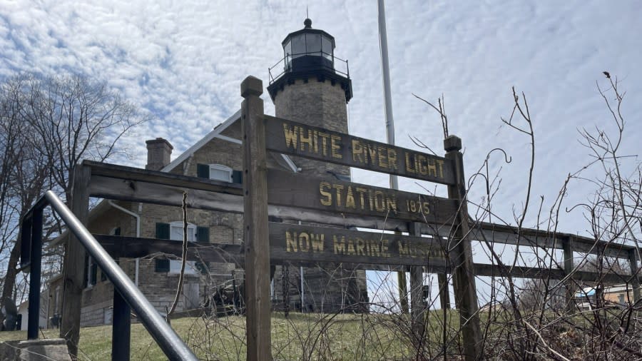 An old wooden sign reads: "White River Light Station 1875, Now Marine Museum."