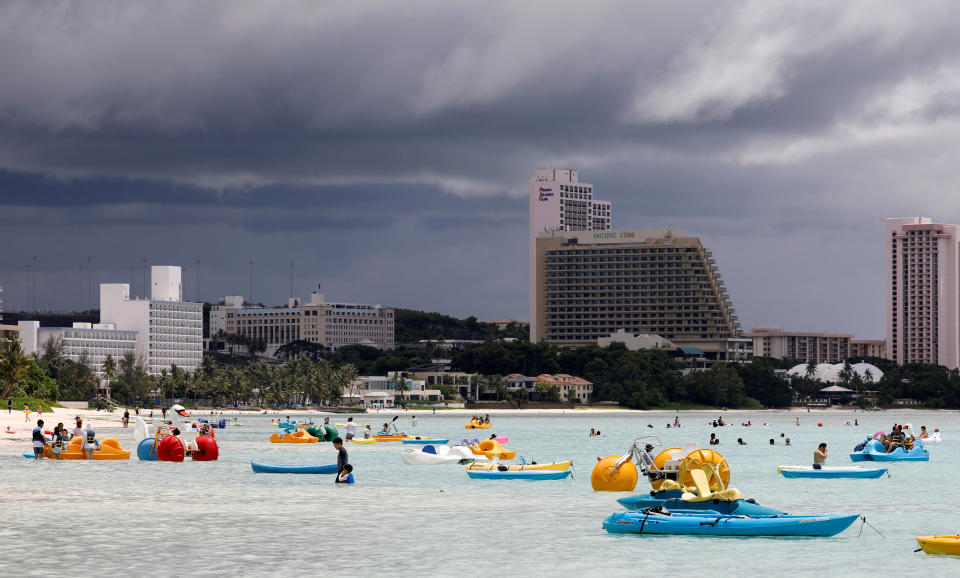 <p>Tourists frolic on the waters overlooking posh hotels in Tumon tourist district on the island of Guam, a U.S. Pacific Territory, August 10, 2017. (Erik De Castro/Reuters) </p>