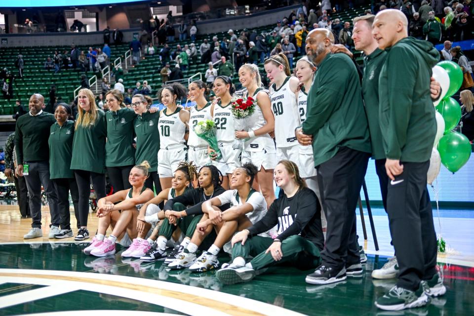 Michigan State women's basketball team poses with seniors Tory Ozment and Moira Joiner during the senior night ceremony after the Spartans win over Illinois on Thursday, Feb. 29, 2024, at the Breslin Center in East Lansing.
