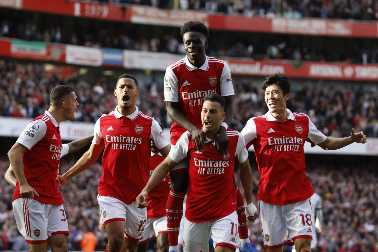 Arsenal's Gabriel Martinelli (jersey No.11) celebrates scoring their first goal against Liverpool with his teammates in their English Premier League match.