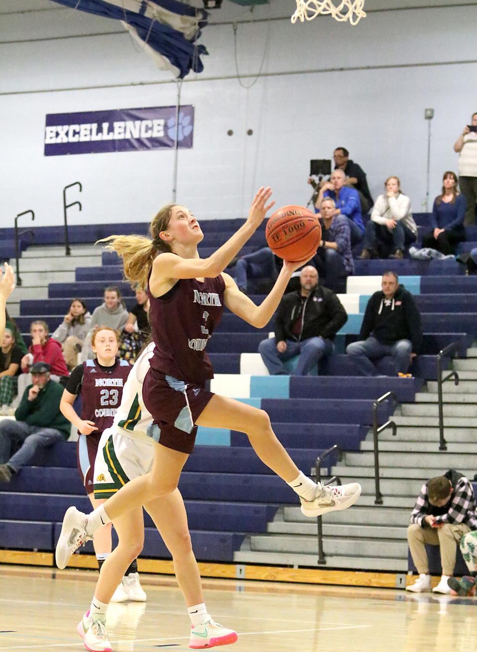 North Country's Sabine Brueck goes up for two points during the Falcons 43-21 win over Burr and Burton in the championship game of the Cougar Holiday Festival earlier this season.