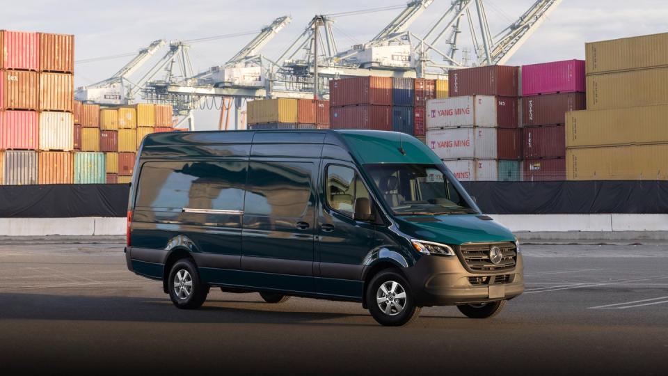 a car parked in front of a large container