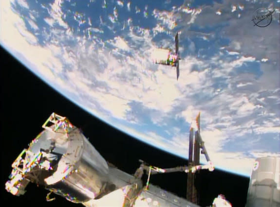 Orbital Sciences' Cygnus commercial cargo ship is on its final approach to the International Space Station before being captured by a robotic arm on Jan. 12, 2014. The spacecraft is carrying 2,780 pounds of supplies to the station.