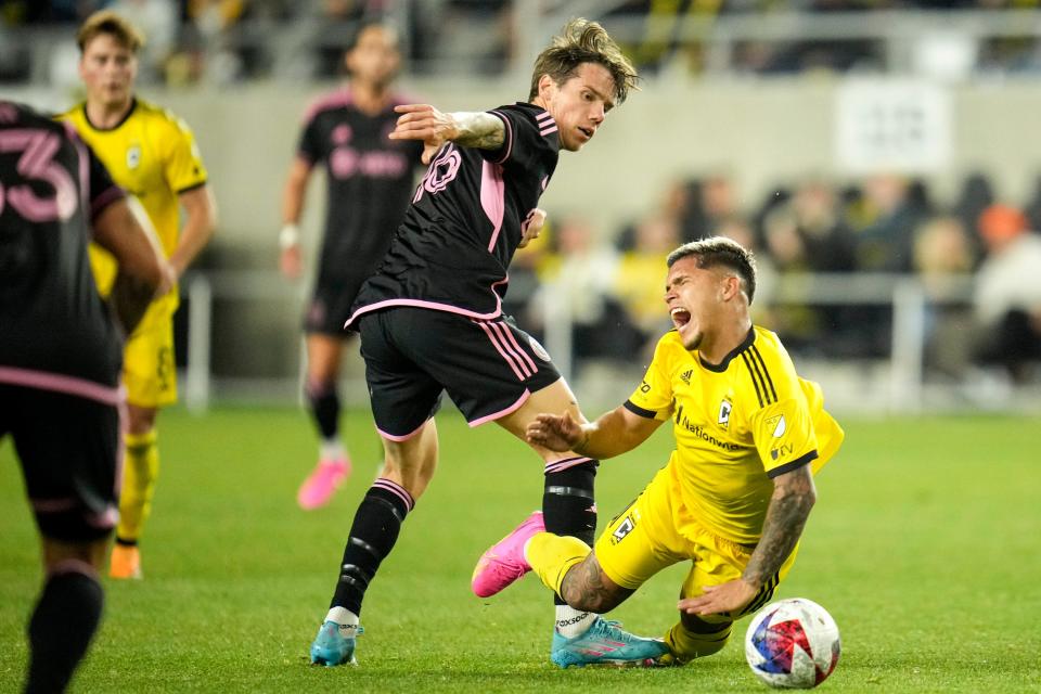 Apr 29, 2023; Columbus, Ohio, United States;  Columbus Crew forward Cucho Hernandez (9) falls after fighting Inter Miami midfielder Robert Taylor (16) for the ball during the second half of the MLS soccer game between Columbus Crew and Inter Miami at Lower.com Field on Saturday night. Mandatory Credit: Joseph Scheller-The Columbus Dispatch