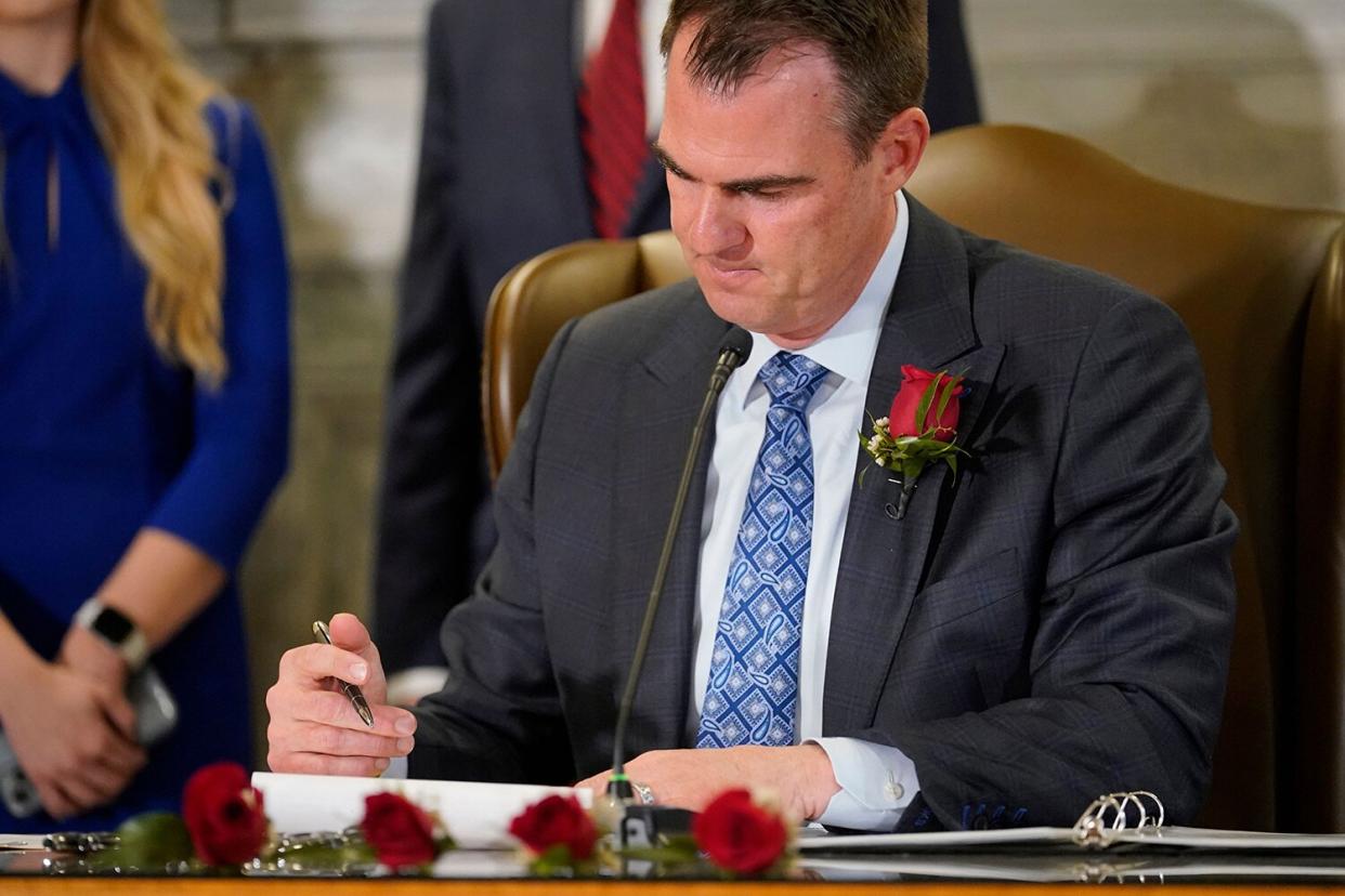 Oklahoma Gov. Kevin Stitt signs into law a bill making it a felony to perform an abortion