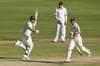 Shaun Marsh (L) of Australia celebrates reaching 100 runs during day one of the First Test match between South Africa and Australia on February 12, 2014 in Centurion, South Africa. (Photo by Morne de Klerk/Getty Images)