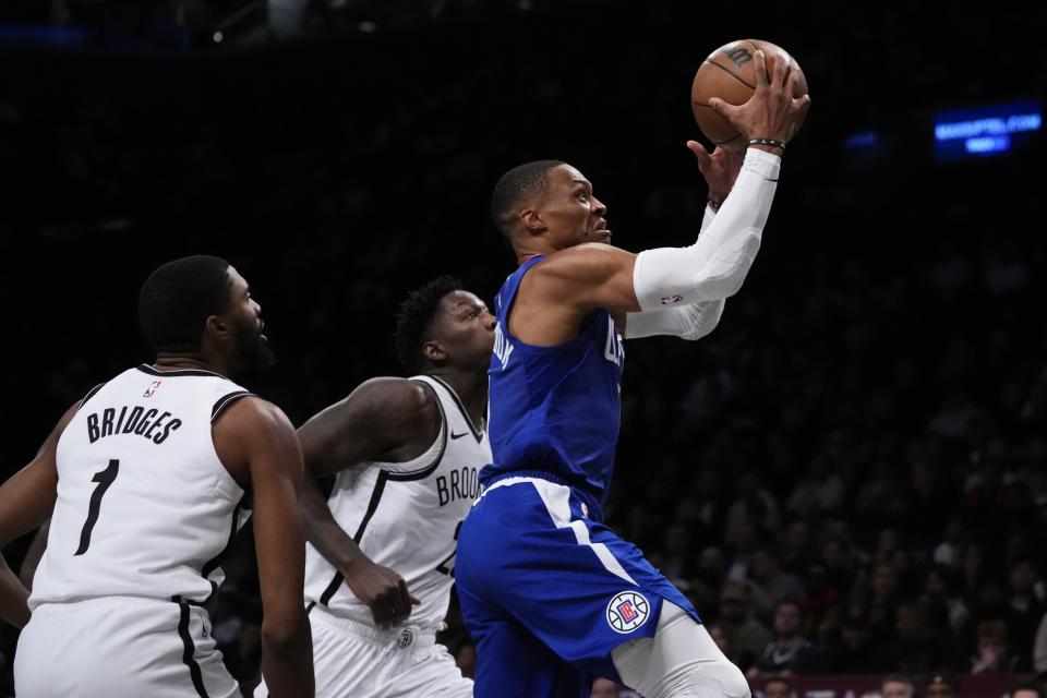 LA Clippers' Russell Westbrook (0) drives past Brooklyn Nets' Mikal Bridges (1) during the second half of an NBA basketball game Wednesday, Nov. 8, 2023, in New York. The Nets won 100-93. (AP Photo/Frank Franklin II)