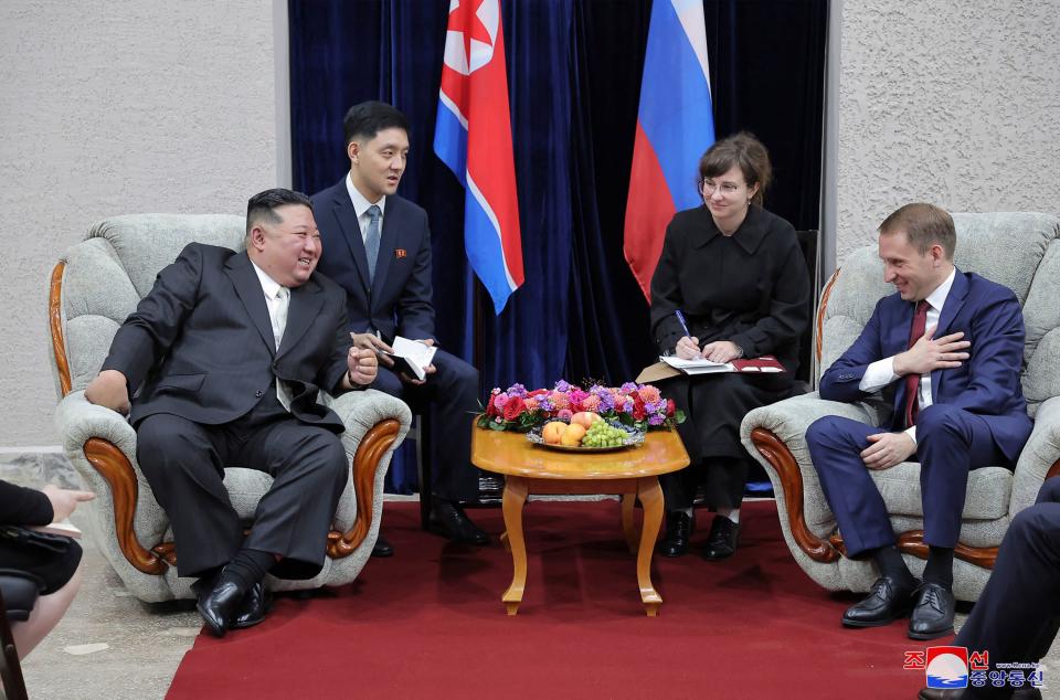 im Jong Un (L) chatting with Alexander Kozlov, minister of Natural Resources and Ecology of Russia (KCNA VIA KNS/AFP via Getty Image)