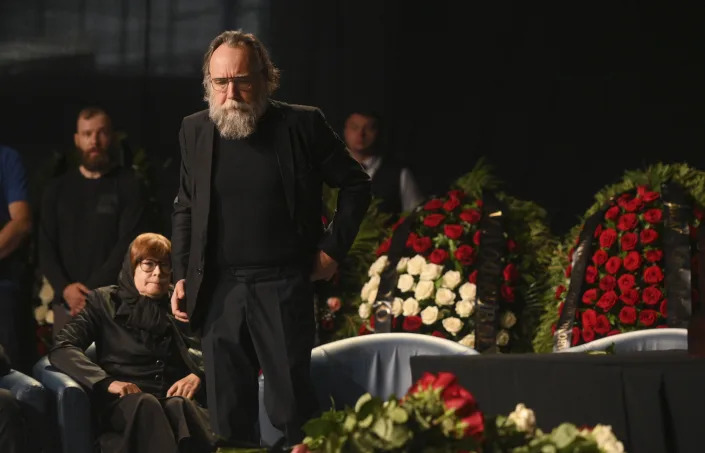 Philosopher Alexander Dugin attends the final farewell ceremony for his daughter Daria Dugina in Moscow, Russia, Tuesday, Aug. 23, 2022. Daria Dugina, a 29-year-old commentator with a nationalist Russian TV channel, died when a remotely controlled explosive device planted in her SUV blew up on Saturday night as she was driving on the outskirts of Moscow, ripping the vehicle apart and killing her on the spot, authorities said. (AP Photo/Dmitry Serebryakov)