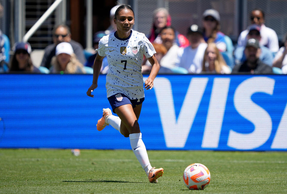 Alyssa Thompson dribbles the ball up field against the Wales National Team in the first half of the Send Off Match.<span class="copyright">Thearon W. Henderson—Getty Images</span>