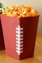 <p>Add a fun twist to this simple snack with paper printables. Even better, you can add these popcorn buckets to any personal snack boxes you want to create for guests. <br></p><p><em><a href="http://blog.hwtm.com/2012/01/free-football-party-printables-homemade-stadium-snack-recipes/" rel="nofollow noopener" target="_blank" data-ylk="slk:Get the tutorial at Hostess With the Mostess »;elm:context_link;itc:0;sec:content-canvas" class="link ">Get the tutorial at Hostess With the Mostess »</a></em> </p>