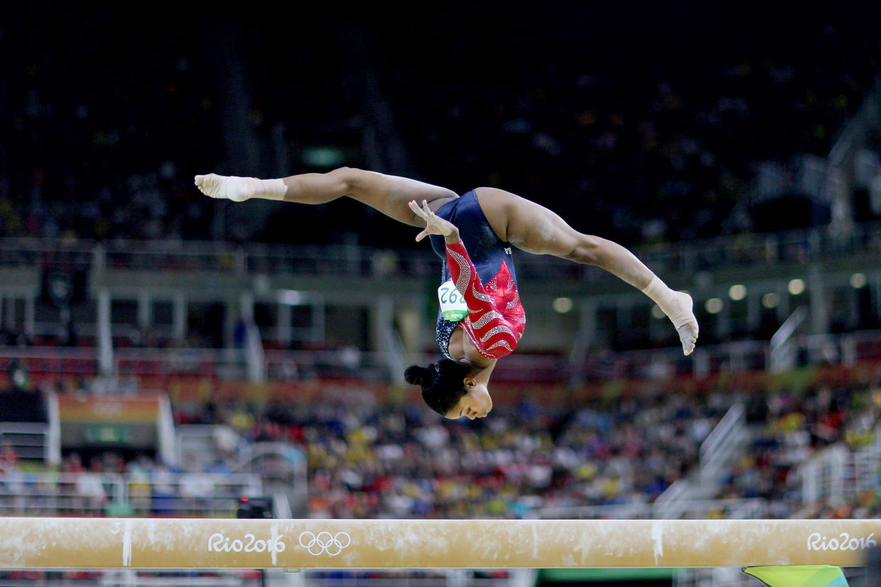 Gabby Douglas performs on the balance beam at the Rio Olympics in 2016. (Tim Clayton / Corbis via Getty Images)