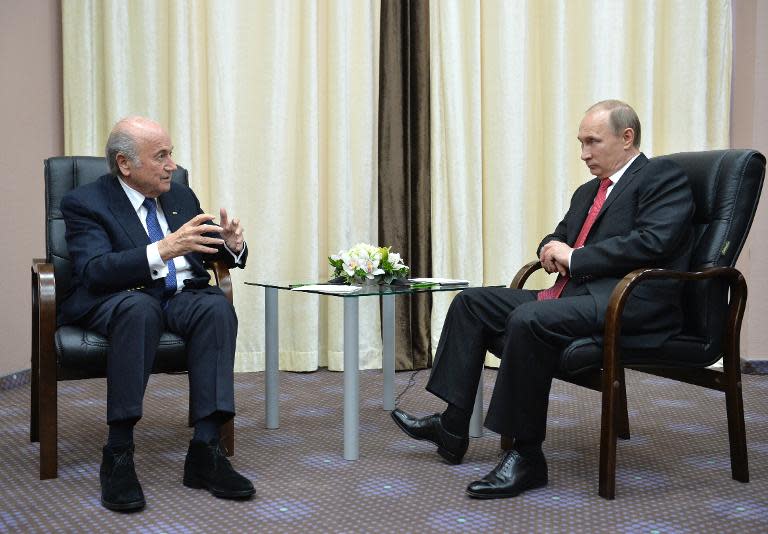 Russian President Vladimir Putin (R) meets with FIFA President Sepp Blatter in Sochi on April 20, 2015