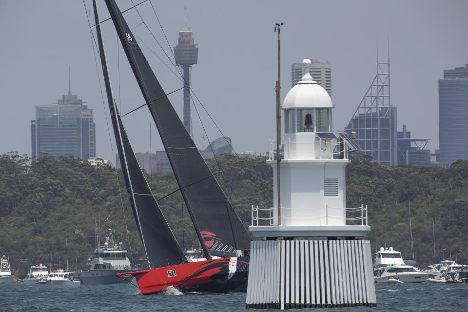 Comanche goes through some final checks before the start of the Sydney Hobart yacht race on Sydney Harbour, Thursday, Dec. 26, 2019. (AP Photo/Steve Chirsto)