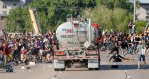 A tanker truck drives into thousands of protesters marching on 35W north bound highway during a protest against the death in Minneapolis police custody of George Floyd, in Minneapolis