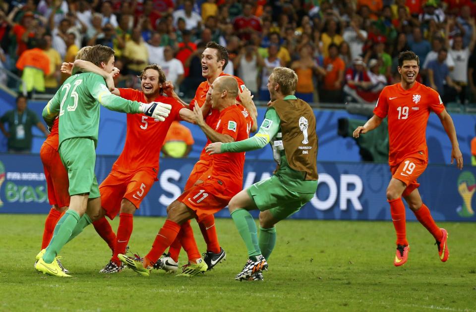 Goalkeeper Tim Krul of the Netherlands celebrates with teammates after the penalty shootout in the 2014 World Cup quarter-finals between Costa Rica and the Netherlands at the Fonte Nova arena in Salvador July 5, 2014. REUTERS/Paul Hanna