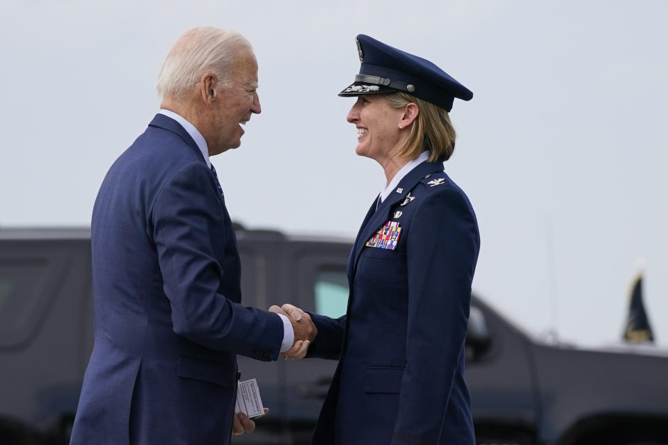 President Joe Biden shakes hands with Col. Angela Ochoa, 89th Air Wing, Joint Base Andrews, as he arrives to board Air Force One for a trip to attend the G20 summit in New Delhi, Thursday, Sept. 7, 2023, in Andrews Air Force Base, Md. (AP Photo/Evan Vucci)