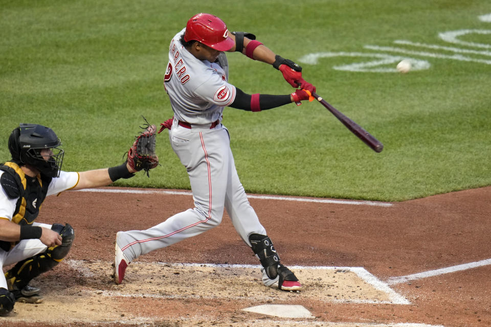 Cincinnati Reds' Jose Barrero hits an RBI sacrifice fly off Pittsburgh Pirates starting pitcher Mitch Keller during the fifth inning of a baseball game in Pittsburgh, Friday, April 21, 2023. (AP Photo/Gene J. Puskar)