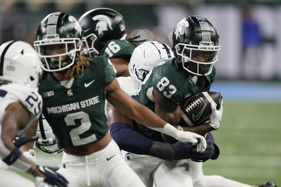 Michigan State wide receiver Montorie Foster Jr. (83) rushes during the first half of an NCAA college football game against Penn State, Friday, Nov. 24, 2023, in Detroit. (AP Photo/Carlos Osorio)