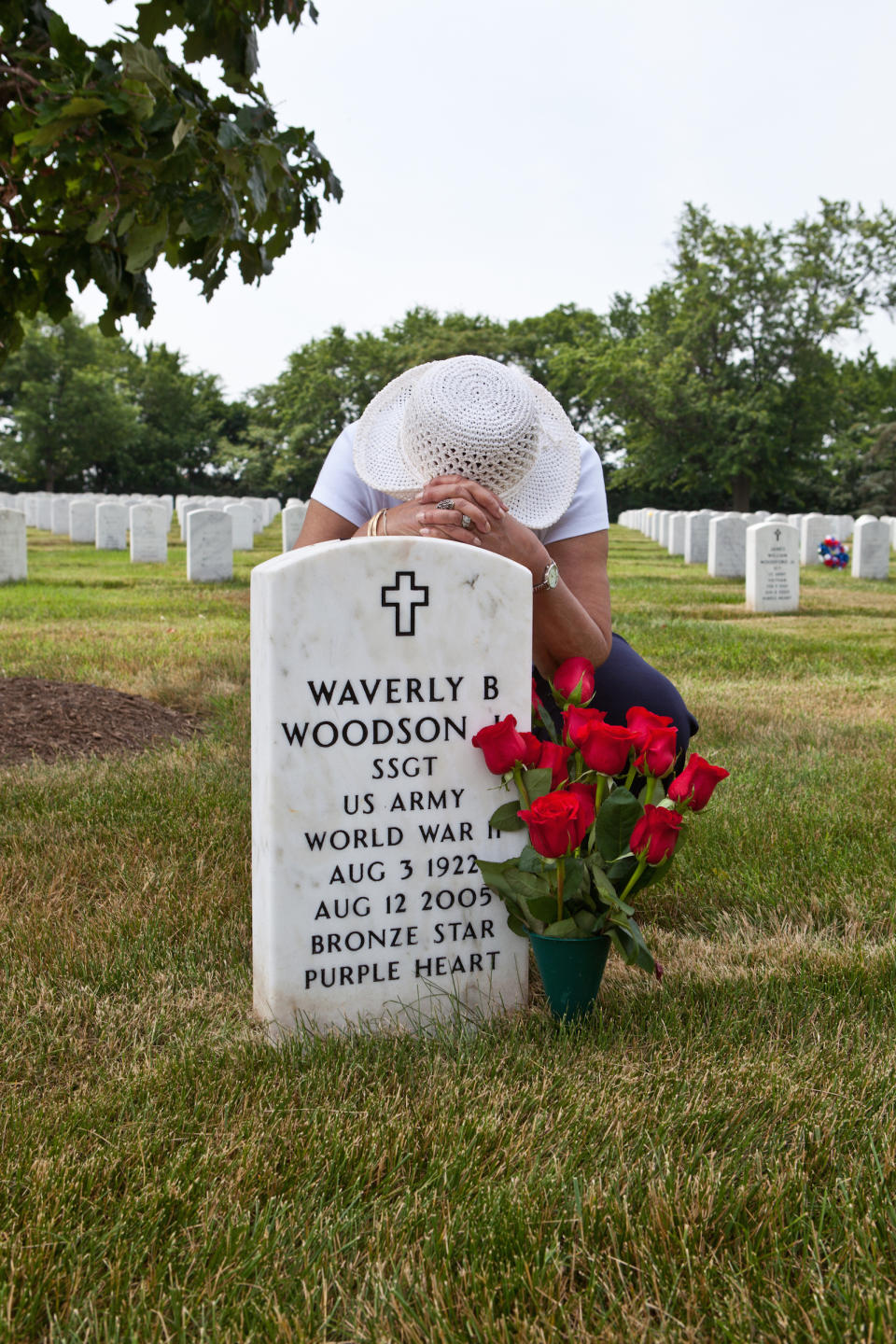 Joann Woodson visits her husband’s grave at Arlington National Cemetery with his favorite red roses. | Linda Hervieux