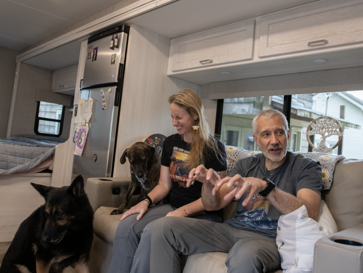 Melissa Cairns and her husband Mark Dailey in their RV with dogs Zeus, 9-year-old German Shepherd, and Aphrodite, 4-year-old mixed breed.