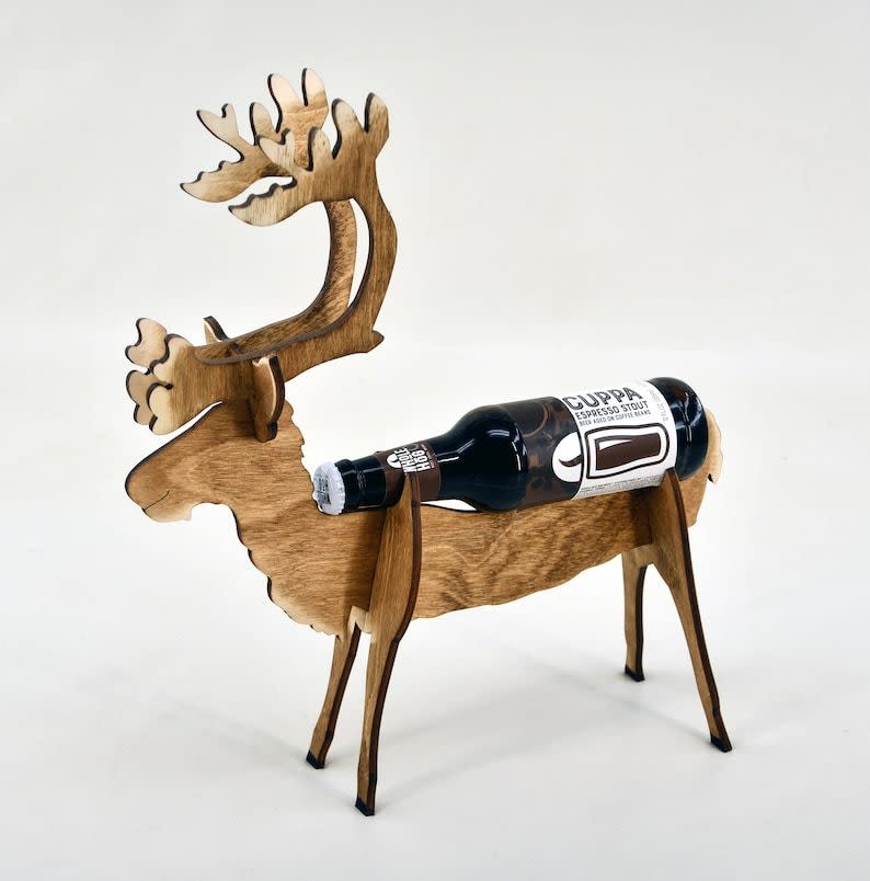 <p><strong>KustomKraftLaser</strong></p><p>Etsy</p><p><strong>$19.99</strong></p><p>Okay, so this isn't <em>exactly </em>an advent calendar. BUT, you can buy enough reindeer displays to make your own advent calendar. Imagine 24 rein-beer pulling Santa's sleigh, which is also filled with more beer?</p>