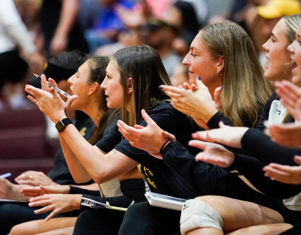 Bishop Verot assistants Mindie Mabry (left) and Chelsey Lockey (right) cheer for their team on Thursday, Oct. 5, 2023 against First Baptist Academy. Mabry and Lockey have helped Verot to a potential 20-win season for the first time since 2017.