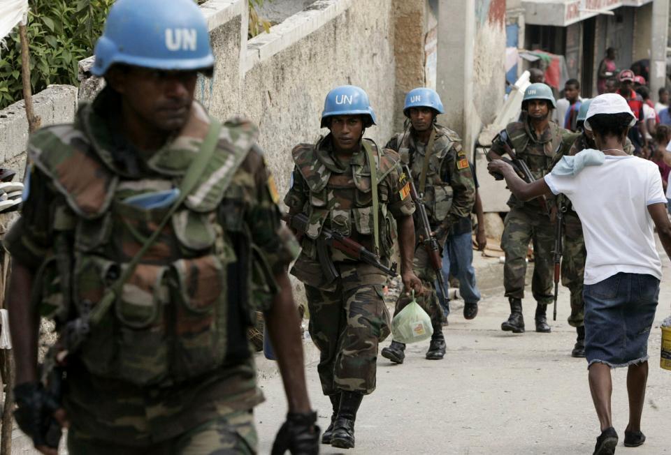 FILE - Members of MINUSTAH, a U.N. force established in 2004, patrol the Marttisant community in Port-au-Prince, Haiti, July 31, 2007. (AP Photo/Ariana Cubillos, File)