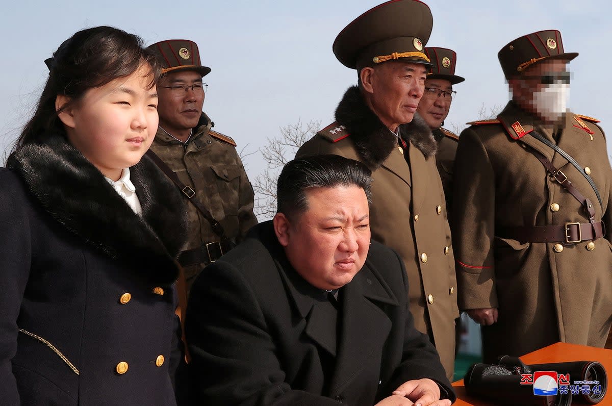 Kim Jong-un and his daughter Kim Ju-ae watch a missile drill at an undisclosed location in this image released by North Korea’s Central News Agency on 20 March (via REUTERS)
