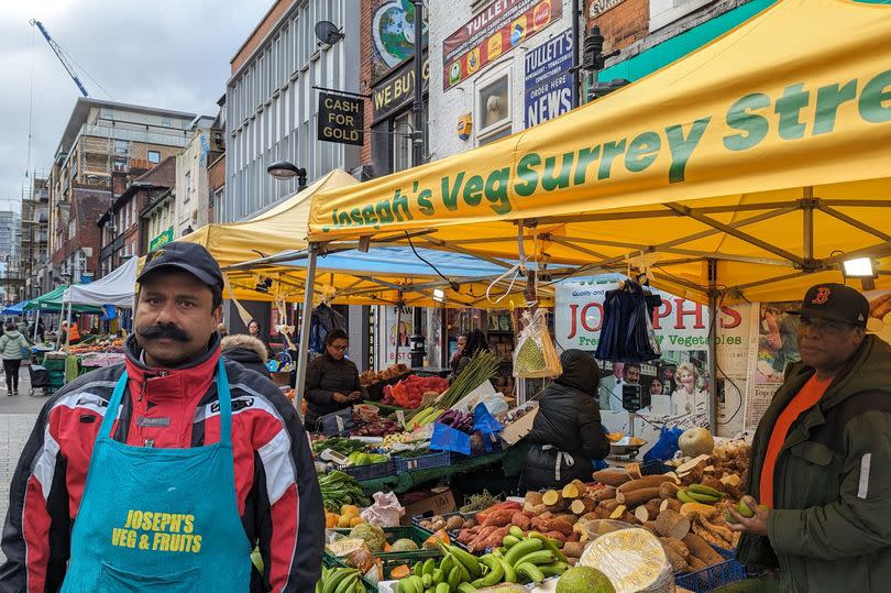 Market trader Jose Joseph outside his fruit and veg stall on Surrey Street Market