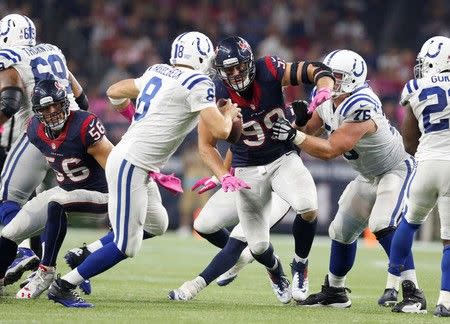 Oct 8, 2015; Houston, TX, USA; Indianapolis Colts quarterback Matt Hasselbeck (8) is pressured by Houston Texans defensive end J.J. Watt (99) at NRG Stadium. Matthew Emmons-USA TODAY Sports