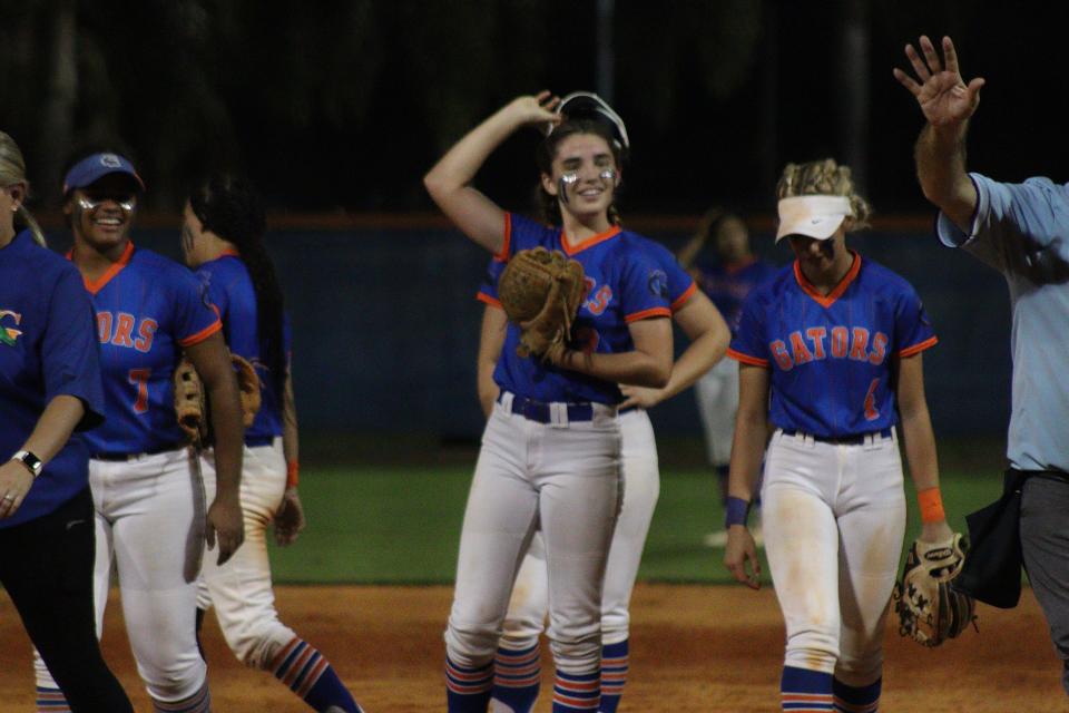 Freshman pitcher Sydney Shaffer smiles after getting Palm Beach Gardens out of the inning while hosting Palm Beach Central softball on Tuesday, Mar. 9, 2022.