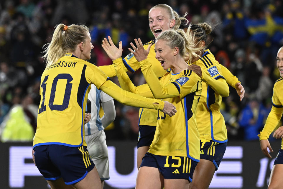 Sweden's Rebecka Blomqvist celebrates with teammate Sweden's Sofia Jakobsson, left, after scoring her team's first goal during the Women's World Cup Group G soccer match between Argentina and Sweden in Hamilton, New Zealand, Wednesday, Aug. 2, 2023. (AP Photo/Andrew Cornaga)