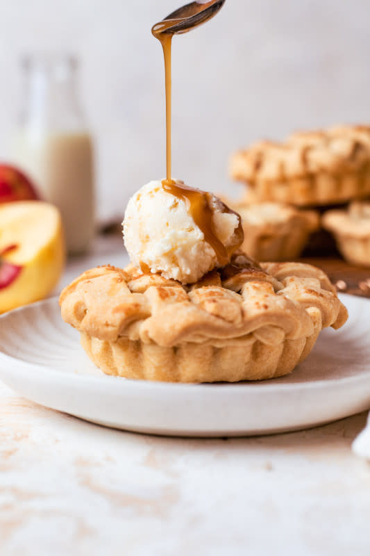 <p>The Banana Diaries</p><p>These super adorable mini apple pies are so easy to make and fun for a deliciously sweet fall dessert!</p><p><strong>Get the recipe: <a href="https://thebananadiaries.com/mini-apple-pies-vegan/" rel="nofollow noopener" target="_blank" data-ylk="slk:Easy Vegan Mini Apple Pies;elm:context_link;itc:0;sec:content-canvas" class="link rapid-noclick-resp">Easy Vegan Mini Apple Pies</a></strong></p>
