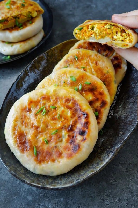 <p>The Foodie Takes Flight</p><p>These are Chinese-style savory breakfast pancakes filled with a mix of scrambled tofu and veggies!</p><p><strong>Get the recipe: <a href="https://thefoodietakesflight.com/chinese-style-savoury-stuffed-breakfast-pancakes-vegan-recipe/" rel="nofollow noopener" target="_blank" data-ylk="slk:Chinese-Style Savory Stuffed Breakfast;elm:context_link;itc:0;sec:content-canvas" class="link rapid-noclick-resp"><em>Chinese-Style Savory Stuffed Breakfast</em></a></strong></p>
