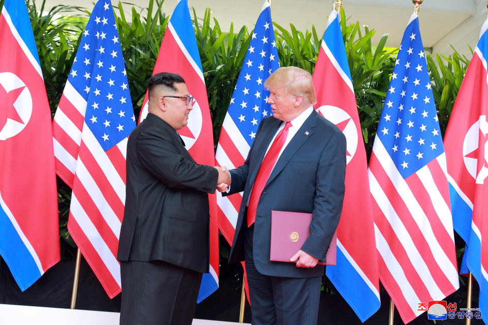 U.S. President Donald Trump shakes hands with North Korean leader Kim Jong Un at the Capella Hotel on Sentosa island in Singapore on Tuesday. (Photo: KCNA/Reuters)