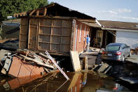 Part of the Starlite Motel is washed away in the aftermath of flooding from Hurricane Florence in Spring Lake, N.C., Wednesday, Sept. 19, 2018. (AP Photo/David Goldman)