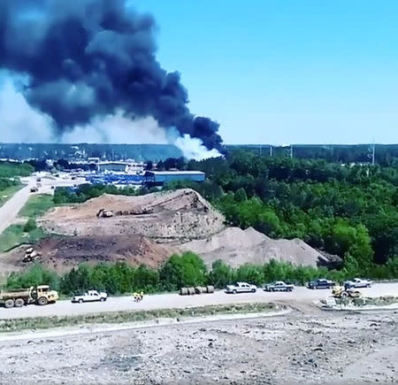 Smoke rises from the site where a Puerto Rico Air National Guard cargo plane crashed near Savannah, Georgia, the U.S., in this still image taken from a May 2, 2018 video obtained from social media. MANDATORY CREDIT. Roger Best/via REUTERS