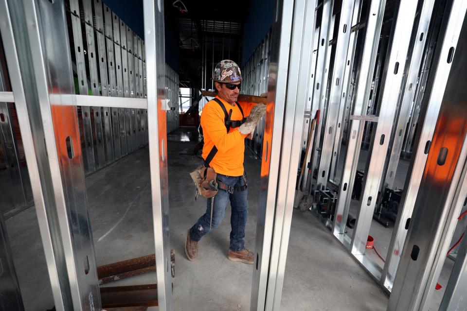 Mike Herrera works on phase three of the Salt Lake City International Airport construction in Concourse B in Salt Lake City on Tuesday, June 20, 2023. | Kristin Murphy, Deseret News