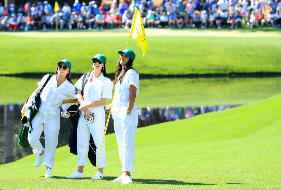 AUGUSTA, GEORGIA - APRIL 10: (L-R) Annie Verret, wife of Jordan Spieth of the United States (not pictured), Jillian Wisniewski, girlfriend of Justin Thomas of the United States (not pictured), and Allison Stokke, girlfriend of Rickie Fowler of the United States (not pictured) look on during the Par 3 Contest prior to the Masters at Augusta National Golf Club on April 10, 2019 in Augusta, Georgia. (Photo by Andrew Redington/Getty Images)