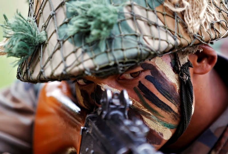 FILE PHOTO: An Indian Army soldier participates in a war exercise during a two-day "Know Your Army" exhibition in Ahmedabad