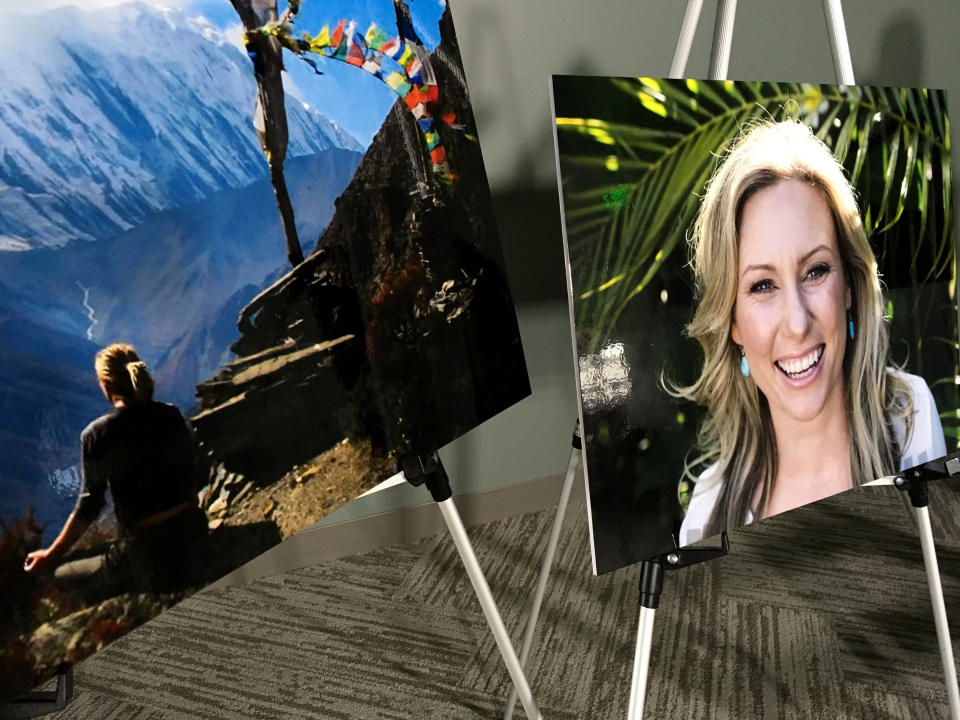 FILE - In this July 23, 2018, file photo, posters of Justine Ruszczyk Damond are displayed at a news conference by attorneys for her family in Minneapolis. Attorneys for Mohamed Noor, a Minneapolis officer who fatally shot the Australian woman last year, have been given approval to inspect the police vehicle from which the shot was fired. Noor's lawyers asked for access to the SUV Friday, Dec. 28 because the moon will be in the same phase as it was on the night in July 2017 when Damond was killed behind her home. A Hennepin County judge approved the request Thursday, Dec. 27. (AP Photo/Amy Forliti, File)