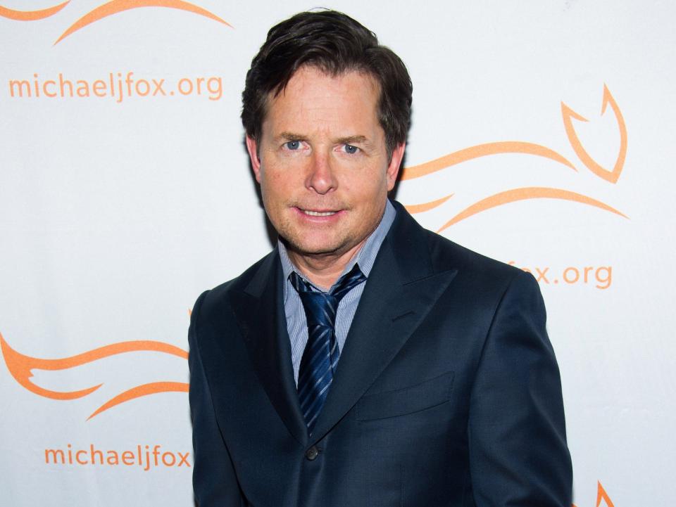 Michael J. Fox wearing a blue suit in 2013