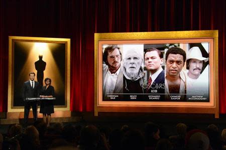 Actor Chris Hemsworth (L) and Academy of Motion Picture Arts and Sciences President Cheryl Boone Isaacs announce the nominees for Best Actor at the 86th Academy Awards nominee announcements in Beverly Hills, California January 16, 2014. REUTERS/Phil McCarten