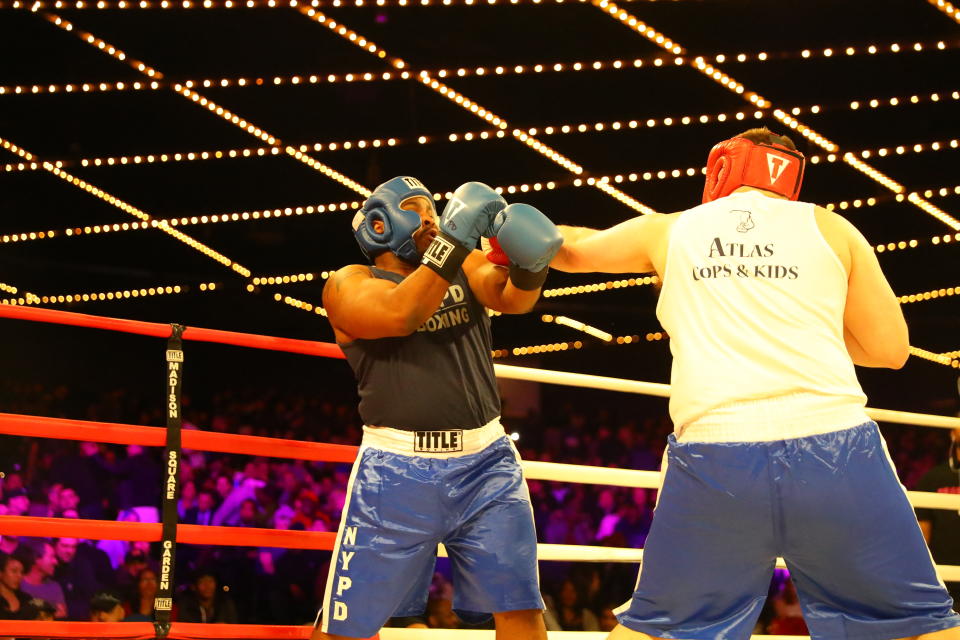 <p>Anthony P. (red) of the 50th Precinct in the Bronx fights fellow officer Rohan Lumsden (blue) in the 50th Precinct grudge match during the NYPD Boxing Championships at the Hulu Theater at Madison Square Garden on March 15, 2018. (Gordon Donovan/Yahoo News) </p>