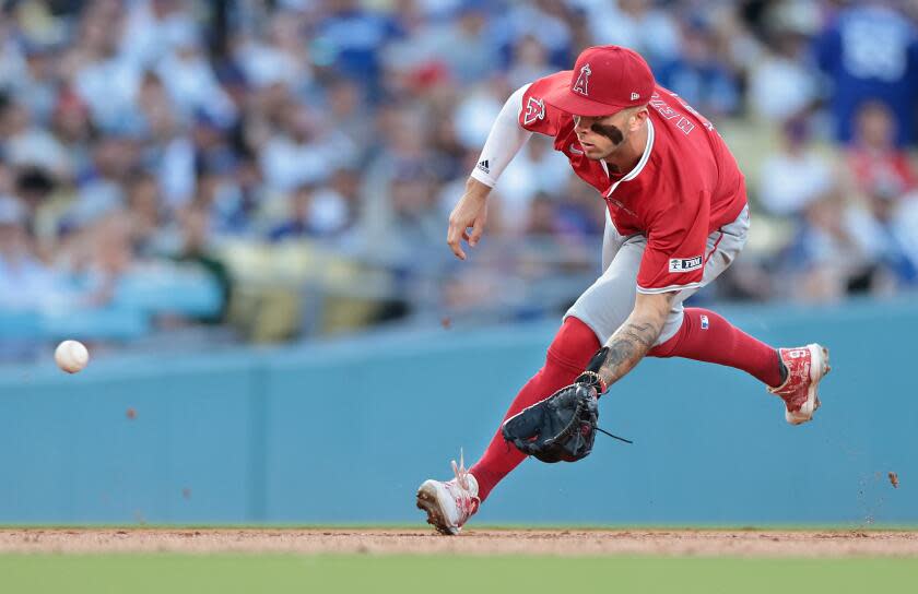 LOS ANGELES, CALIFORNIA- Angels shortstop Zach Neto fields a ball against the Dodgers.