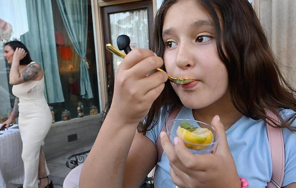 Sneak preview samples of Lemon Granita Italian ice served in cored lemons from Gelateria Del Centro are enjoyed during ArtHop Thursday, Aug. 3, 2023. Co-Owners Jordan Sanchez and Tami Waters hope to open the shop in September.