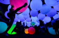 <p>Visitors look at digital light effects by Japan based digital art group teamLab during the ‘Dance! Art Exhibition, Learn and Play! Future Park’ in Taipei, Taiwan, Feb. 23, 2017. (Photo: Ritchie B. Tongo/EPA) </p>